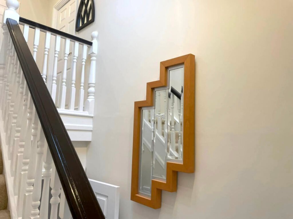 hallway cream painted walls stairs feature mirror cardiff primrose decor