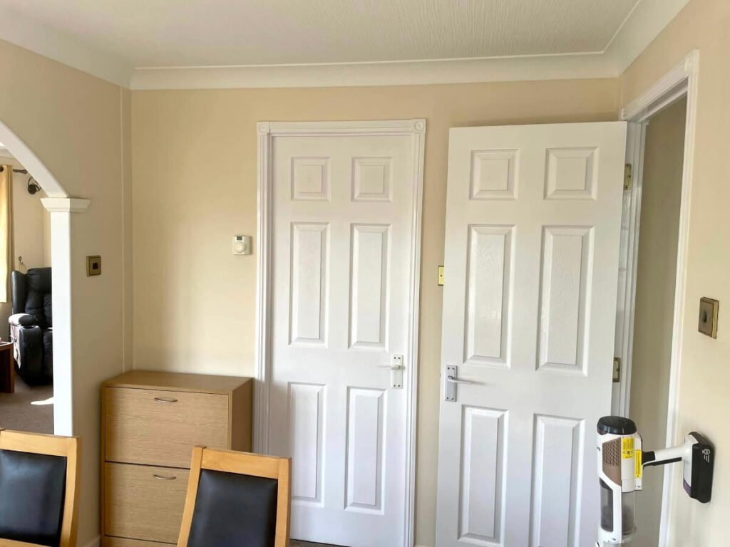 hallway cream painted walls two white doors cardiff primrose decor