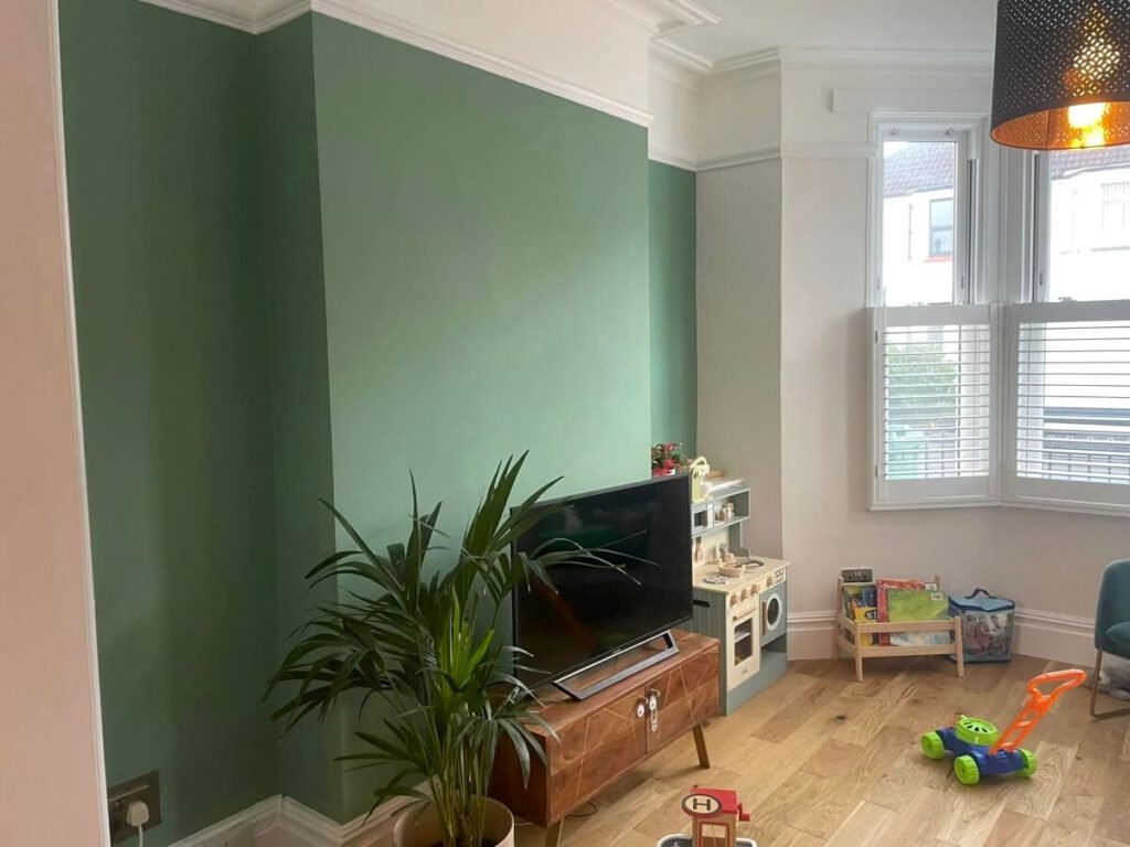 playroom aqua painted feature wall tv toys cardiff primrose decor